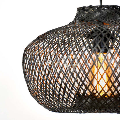 Black metal mesh pendant light with rounded form and open weave structure showing warm bulb glow hanging against neutral wall background for industrial decor.