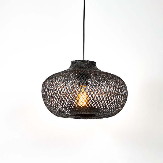 Black woven bamboo pendant light illuminated with warm glow creating elegant modern ambiance.