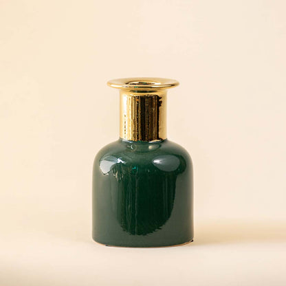 Dark green ceramic decorative vase with gold rim detail for contemporary tabletop styling and elegant home decor.