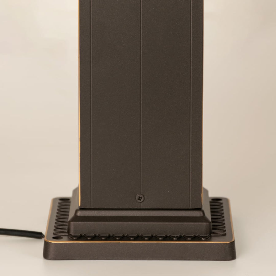 Closeup of brown decorative outdoor pillar lamp showing Chinese pattern frosted glass and clean metal detailing ideal for ambient garden lighting.