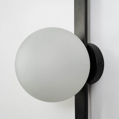 Closeup of oval frosted glass lamp shade on black metal fixture showcasing smooth matte finish and quality build.