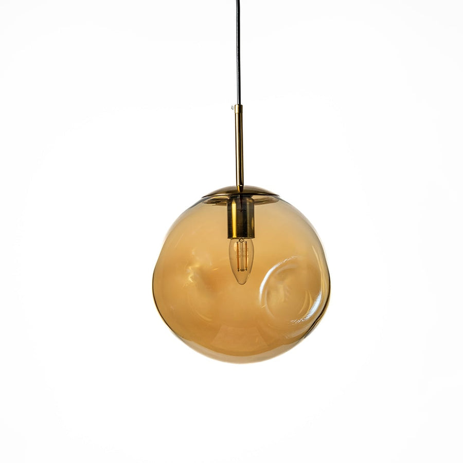 Amber glass globe pendant light with golden metal holder shown on white background ideal for stylish home lighting.