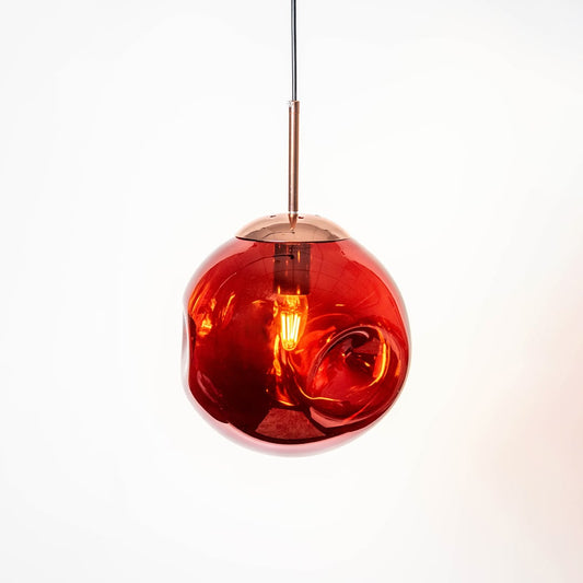 Red glass globe pendant light with black metal accents crafted for modern living and dining spaces.