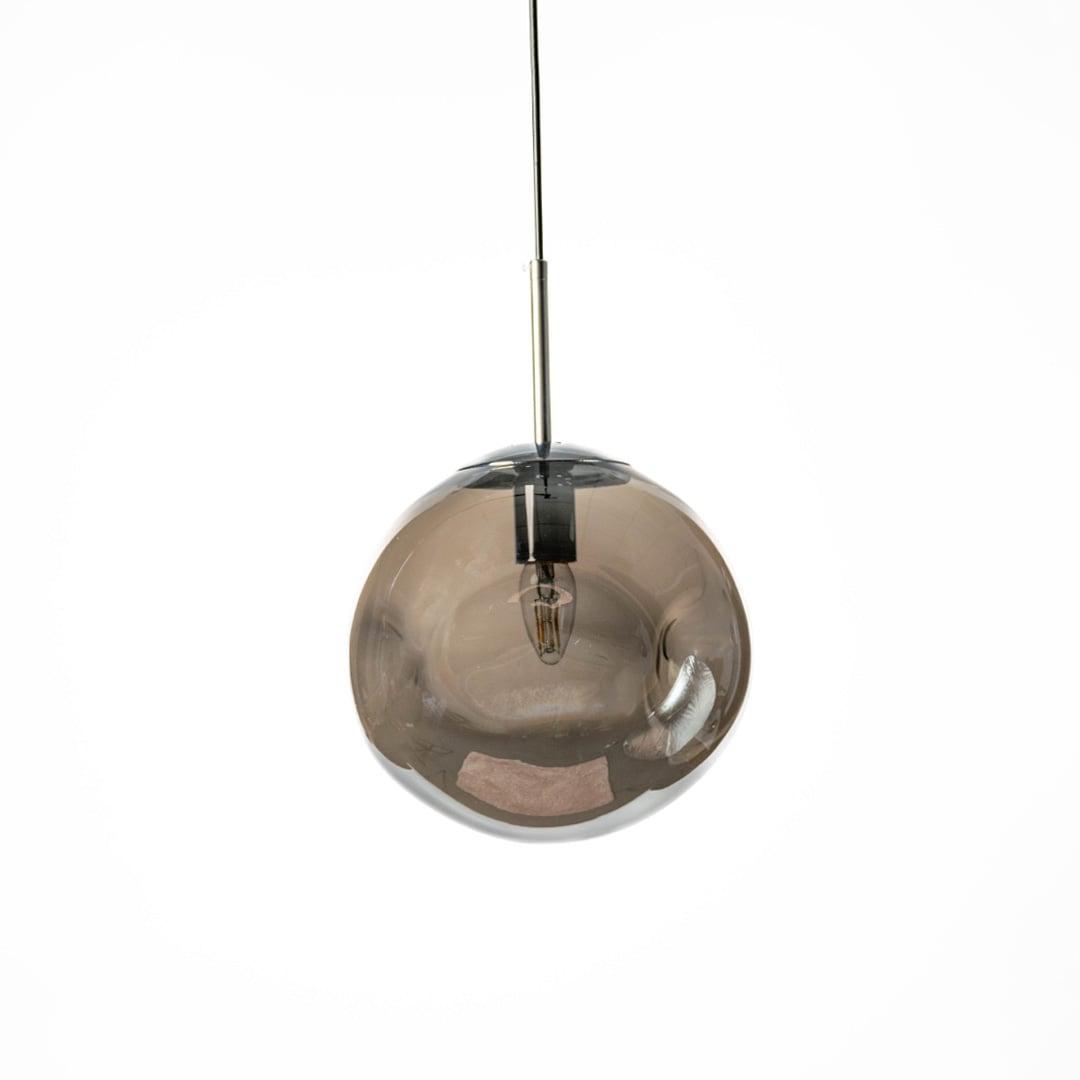 Contemporary round glass pendant light in smoky finish shown on white wall background for stylish interiors.