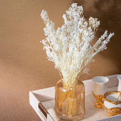 White dried gypsophila preserved bouquet styled in elegant blue vase lifestyle decor for modern interiors.