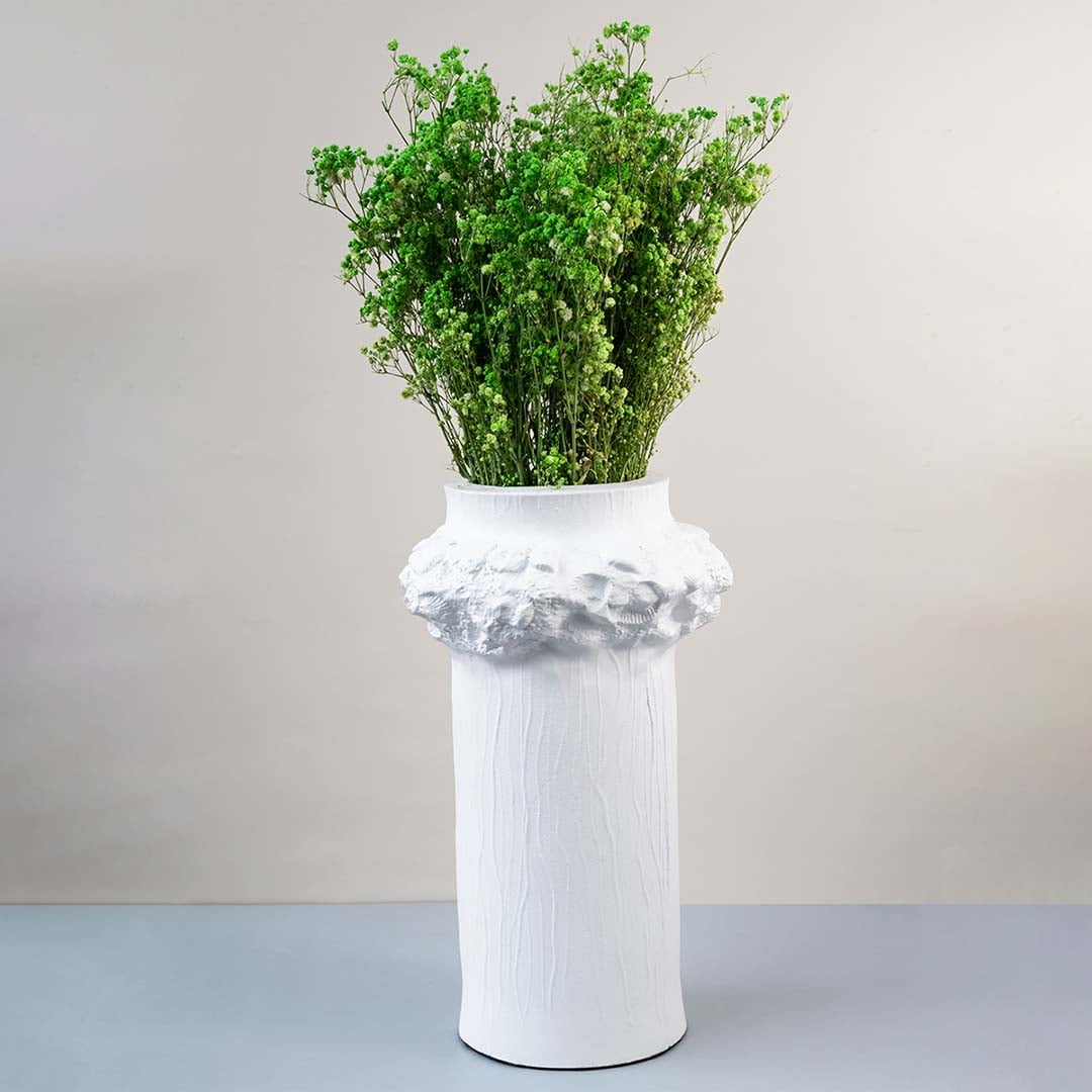 Bright green dried gypsophila styled in a warm modern room adding fresh natural texture to contemporary home decor.