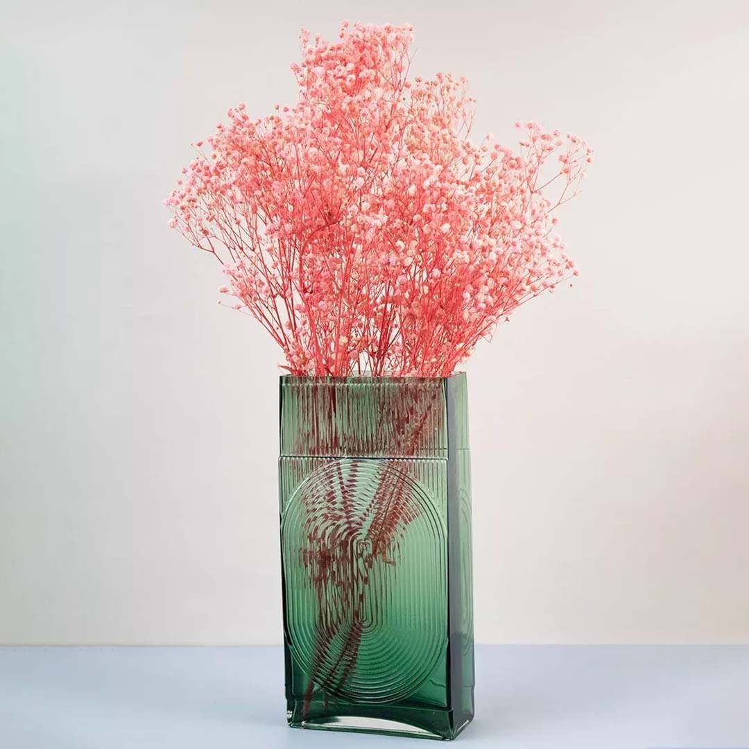 Soft coral dried gypsophila styled in a warm modern room adding gentle natural texture to contemporary home decor.