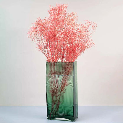 Soft coral dried gypsophila styled in a warm modern room adding gentle natural texture to contemporary home decor.