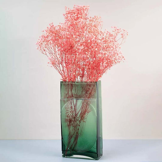 Soft coral dried gypsophila styled in a warm modern room adding gentle natural texture to contemporary home decor.