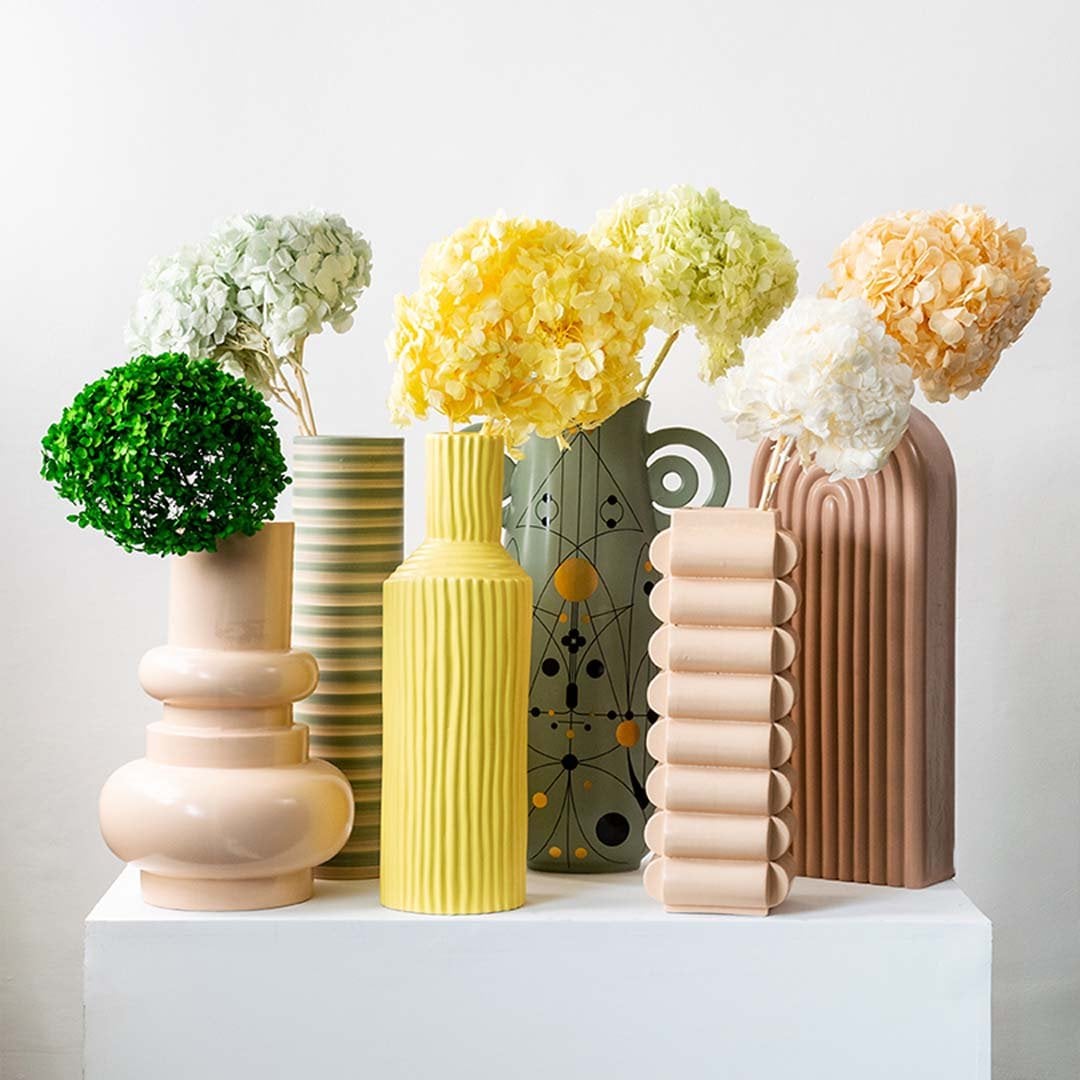 Collection of beige dried hydrangea stems displayed together creating a warm natural look for modern home decoration.