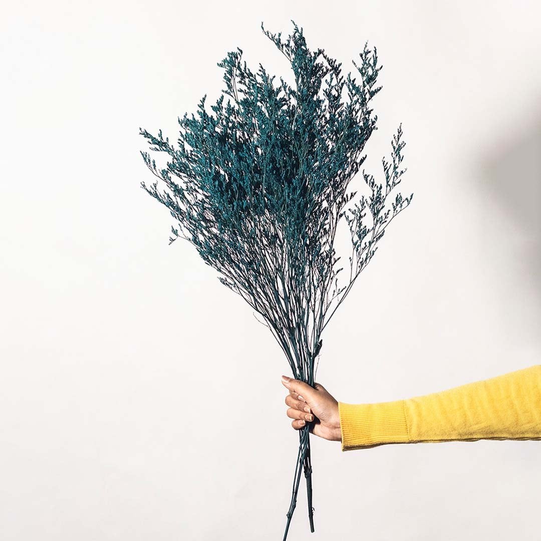 Artificial preserved teal limonium stem with natural branch base ideal for vases floral decoration and modern home styling.