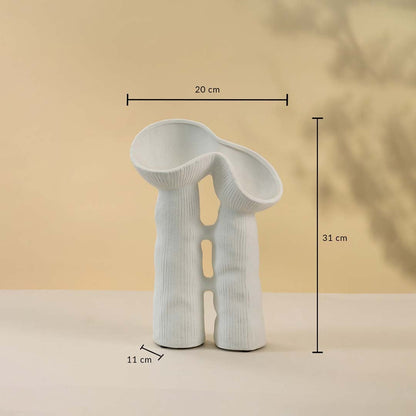 White sculptural ceramic vase measuring 31 cm in height and 20 cm in width displayed with measurements.