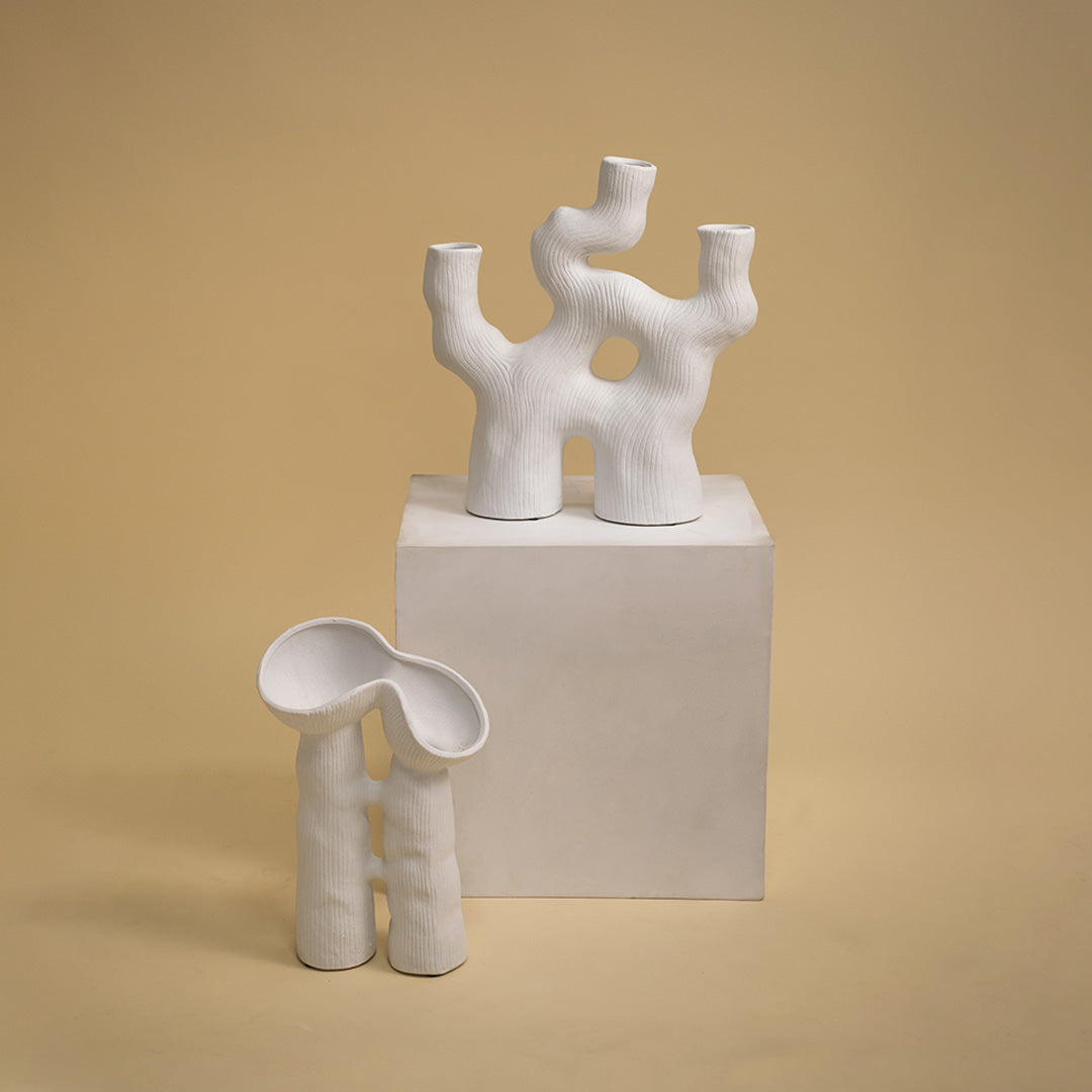 White ceramic abstract decorative sculpture with artistic form for contemporary shelf styling and modern home decor.