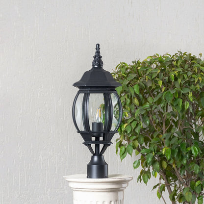 Classic black outdoor pillar lamp with clear curved glass shade placed on stone pillar ideal for entrance and garden.