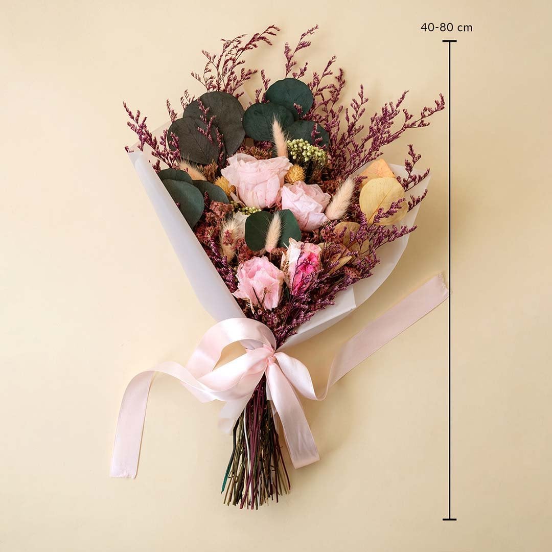 Luxury dried bouquet with infinity rose bunny tail crystal grass and preserved leaves 40 to 80 cm tall tied with pink ribbon.