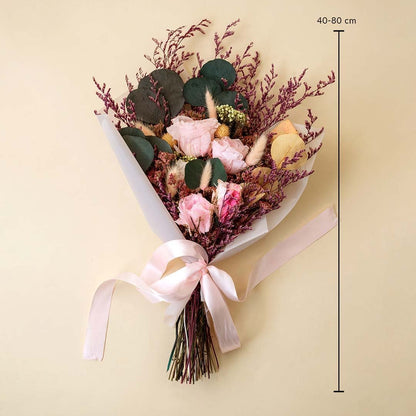 Luxury dried bouquet with infinity rose bunny tail crystal grass and preserved leaves 40 to 80 cm tall tied with pink ribbon.