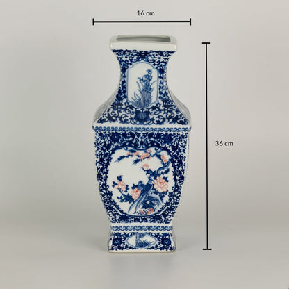 Blue and white ceramic jar with detailed scenic panels shown with dimensions of 35 cm height and 16 cm width creating a richly artistic decorative element for interiors.