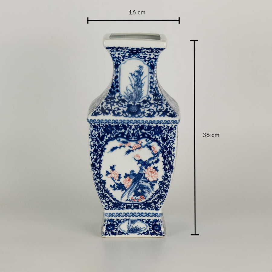 Blue and white ceramic jar with detailed scenic panels shown with dimensions of 35 cm height and 16 cm width creating a richly artistic decorative element for interiors.