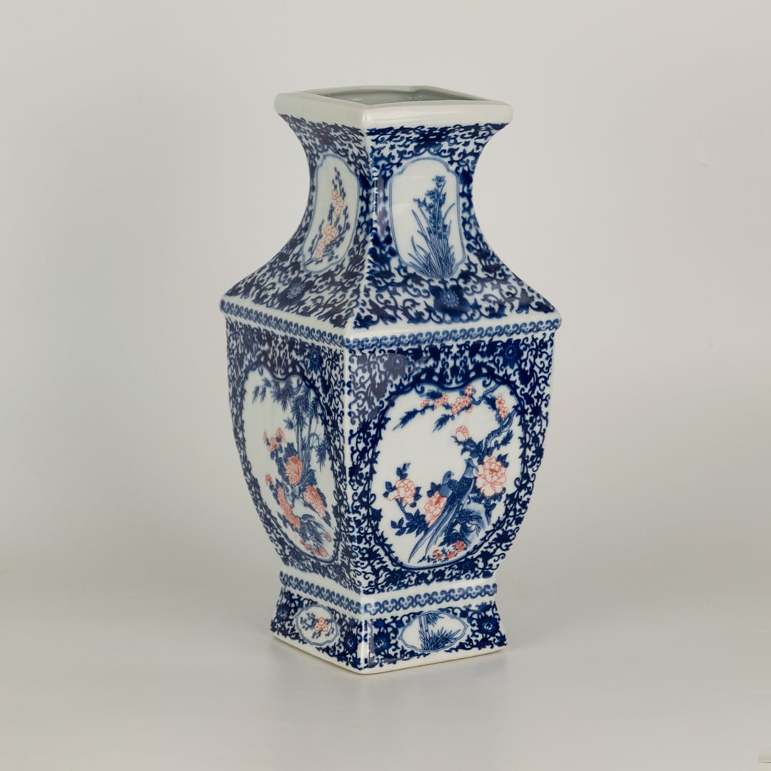 Blue and white ceramic jar with ornate painted panels and classic scenes shown on a clean backdrop creating a detailed artistic accent well suited for traditional home decor.