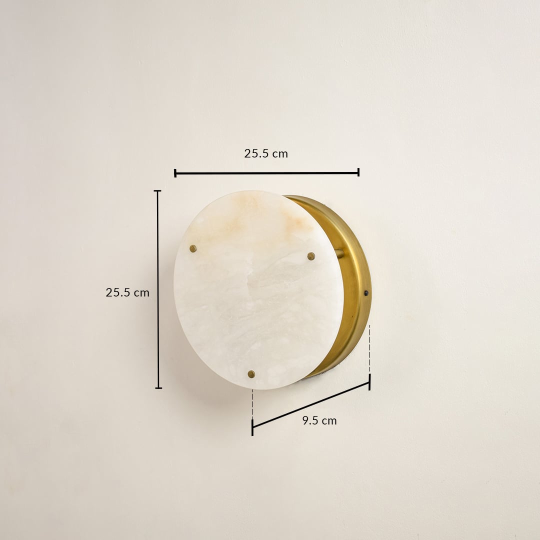 Round wall light with white stone disc and gold metal rim showing 15 cm diameter and 5 cm projection for interior wall installation.