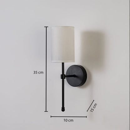 Black metal wall light with white fabric shade shown with 35 cm height 10 cm width and 15 cm depth for accurate indoor wall placement.