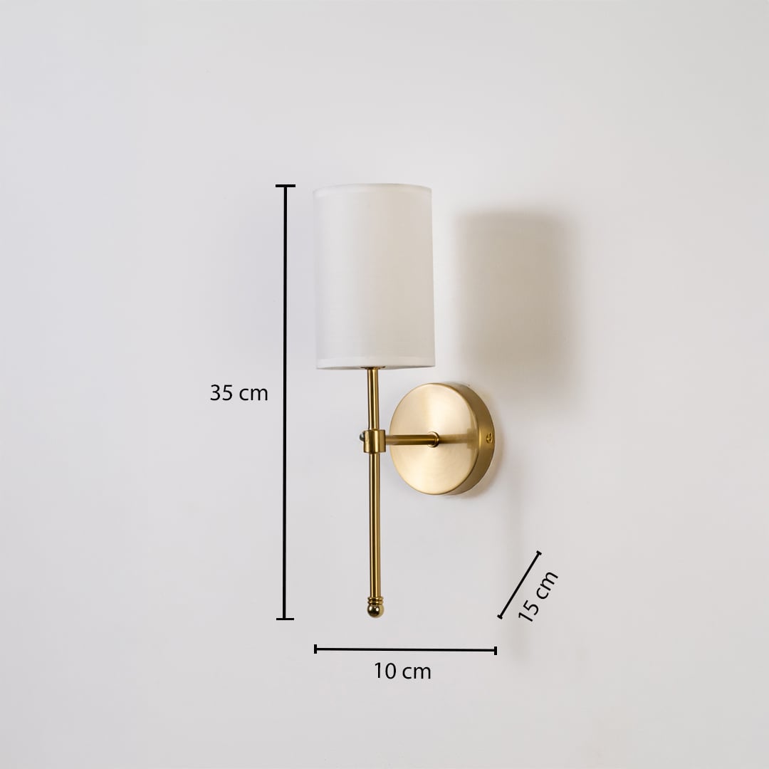 Metal gold wall light with white fabric shade shown with 35 cm height 10 cm width and 15 cm depth for easy wall placement.