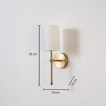 Metal gold wall light with white fabric shade shown with 35 cm height 10 cm width and 15 cm depth for easy wall placement.