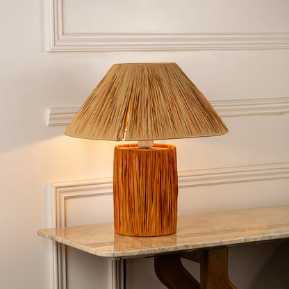 Table lamp with woven shade and textured base perfect for rustic bedroom or living room table decor styling on clean background.
