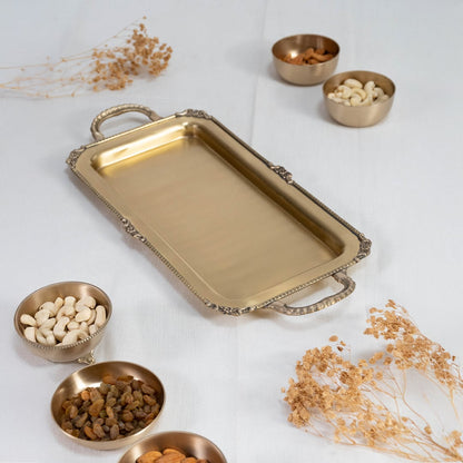 Gold metal serving tray neatly placed inside a black gift box with the lid partially open for packaging view.