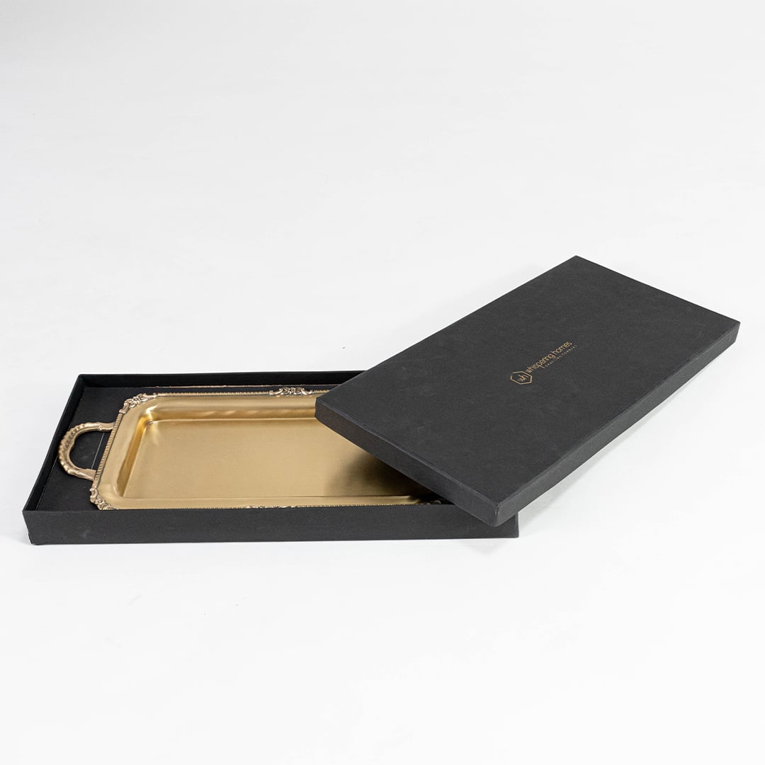 Rectangular gold metal tray with ornate handles displayed empty on plain white background front view.