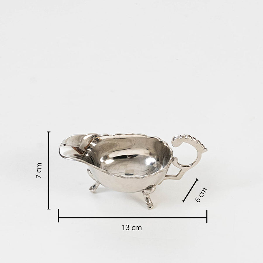 Silver gravy boat shown with labeled dimensions 7 cm height 17 cm length and 6 cm width on clean white background.