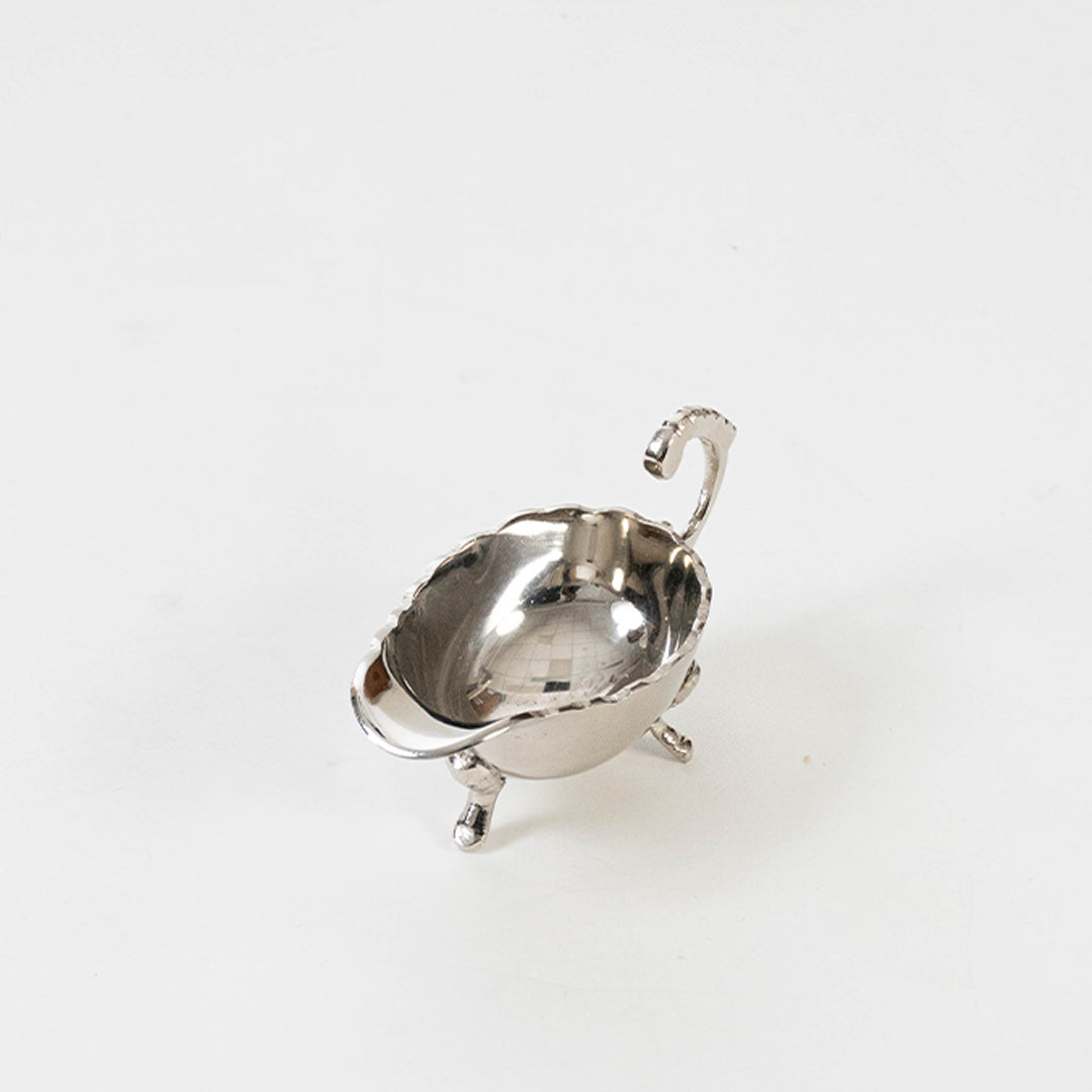 Elegant metal serving dish in silver finish with lid for dining table or serving decor accessory placement white background.