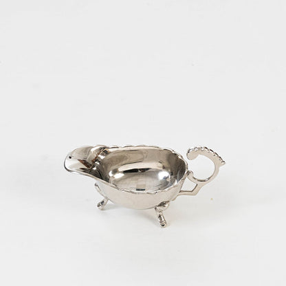 Elegant silver gravy boat packed securely inside a premium black box with foam insert for stylish gifting and storage.