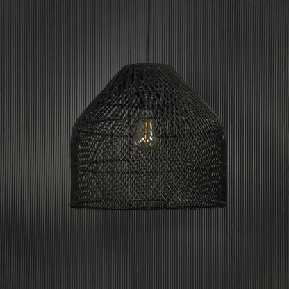 Stylish black rattan pendant lamp against black background highlighting natural weave and sophisticated curved silhouette.