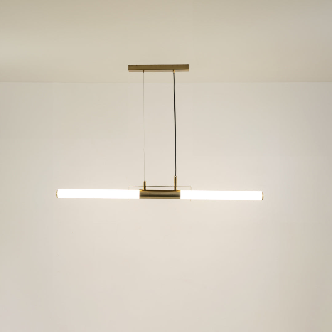 Gold metal linear LED pendant light with integrated illumination offering sleek contemporary ceiling lighting design.