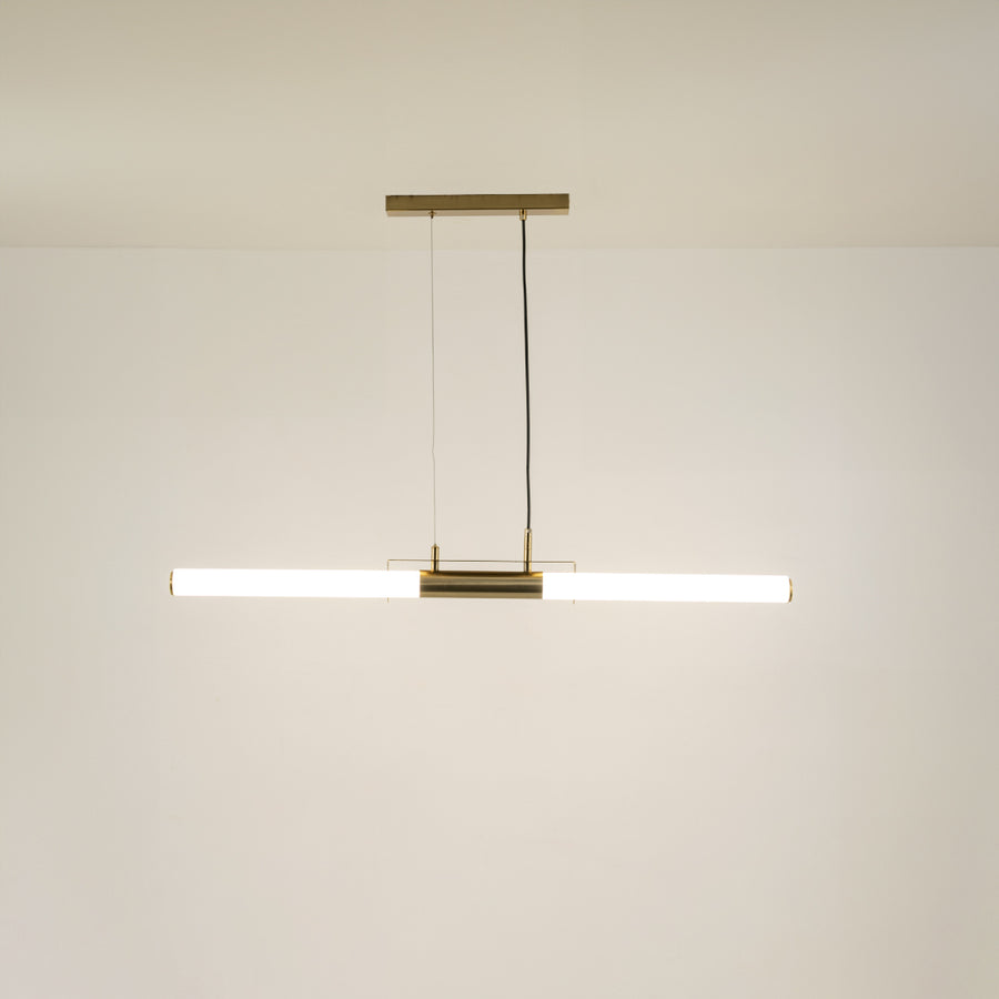 Gold metal linear LED pendant light with integrated illumination offering sleek contemporary ceiling lighting design.