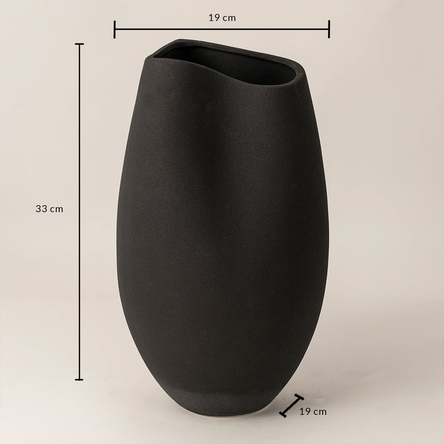 Black ceramic vase measuring 33 cm height and 19 cm width shown on white background with smooth handcrafted finish.