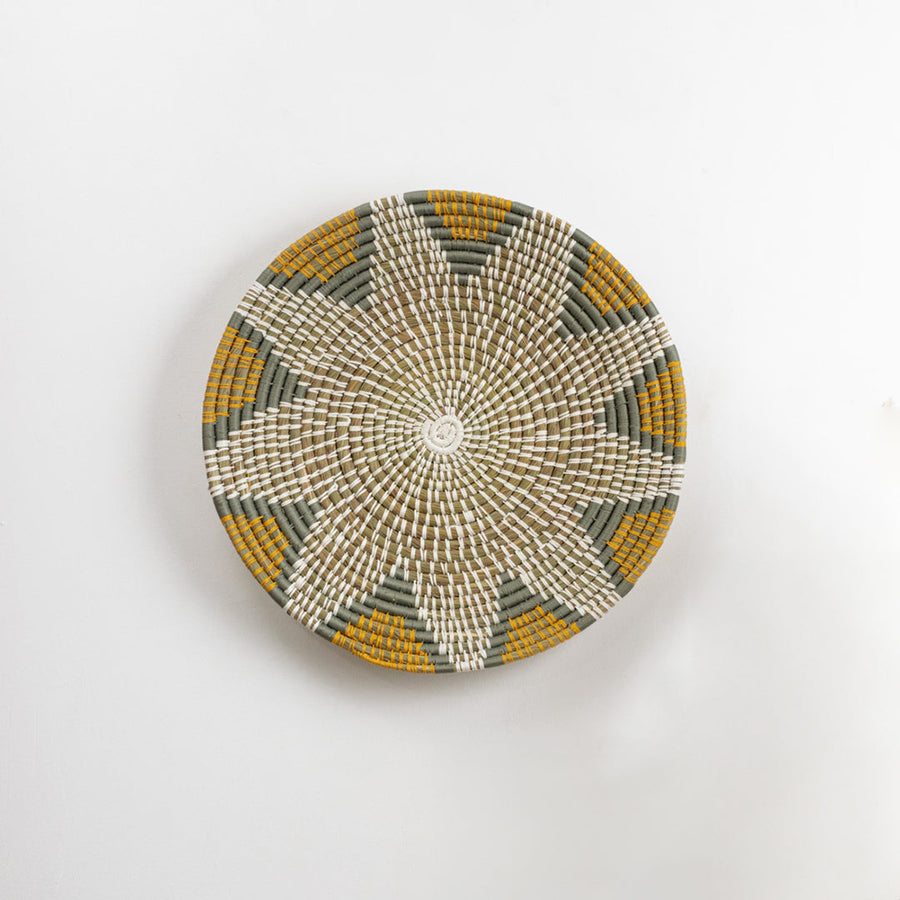 White decorative wall plate with gold floral lattice pattern for contemporary wall styling and luxury home decor.