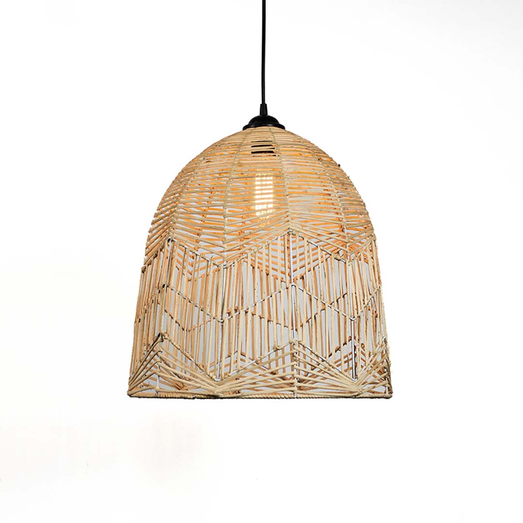 Woven bamboo pendant light glowing warmly on white background showcasing intricate handwoven dome design.