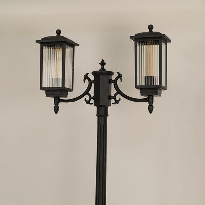 Closeup of black metal outdoor lantern showing ribbed glass and elegant frame details perfect for enhancing driveway garden and entryway Decor.