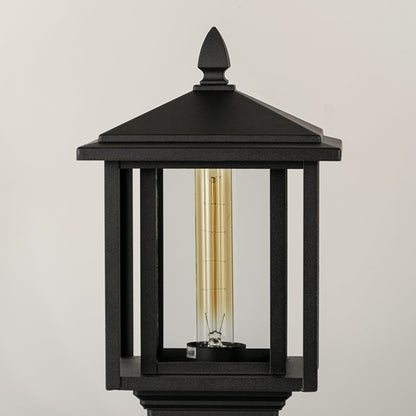 Black outdoor lantern Closeup Light On showing warm glow and decorative pebbled glass panels for exterior lighting.