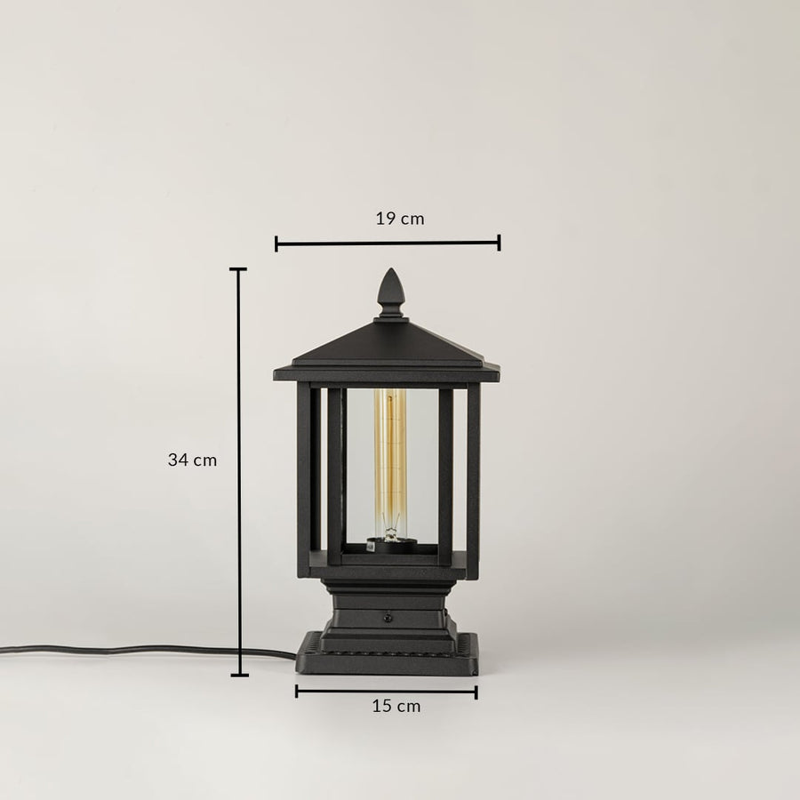 Black outdoor lantern light Dimensions Image 34 cm height by 17 cm top width by 15 cm base width.
