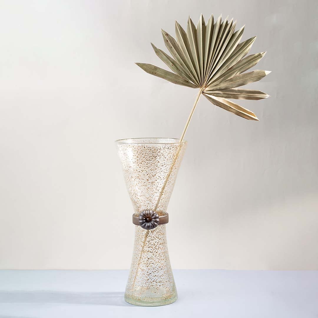 Golden speckled tall glass vase with hourglass design displayed on plain white background for stylish home decor use.