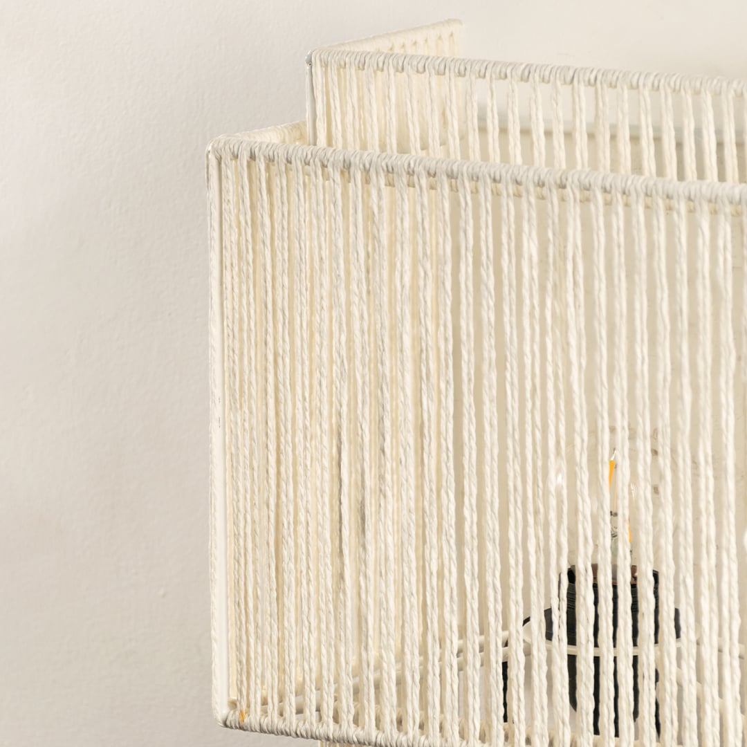 Close view of the detailed white jute weave showcases expert craftsmanship and a textured finish that complements natural-themed interiors.