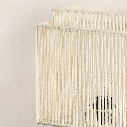 Close view of the detailed white jute weave showcases expert craftsmanship and a textured finish that complements natural-themed interiors.