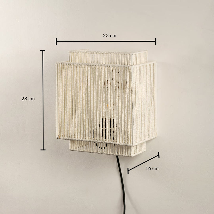 Handwoven jute wall light measuring 28 x 23 x 16 cm combines earthy texture and modern shape ideal for ambient lighting.