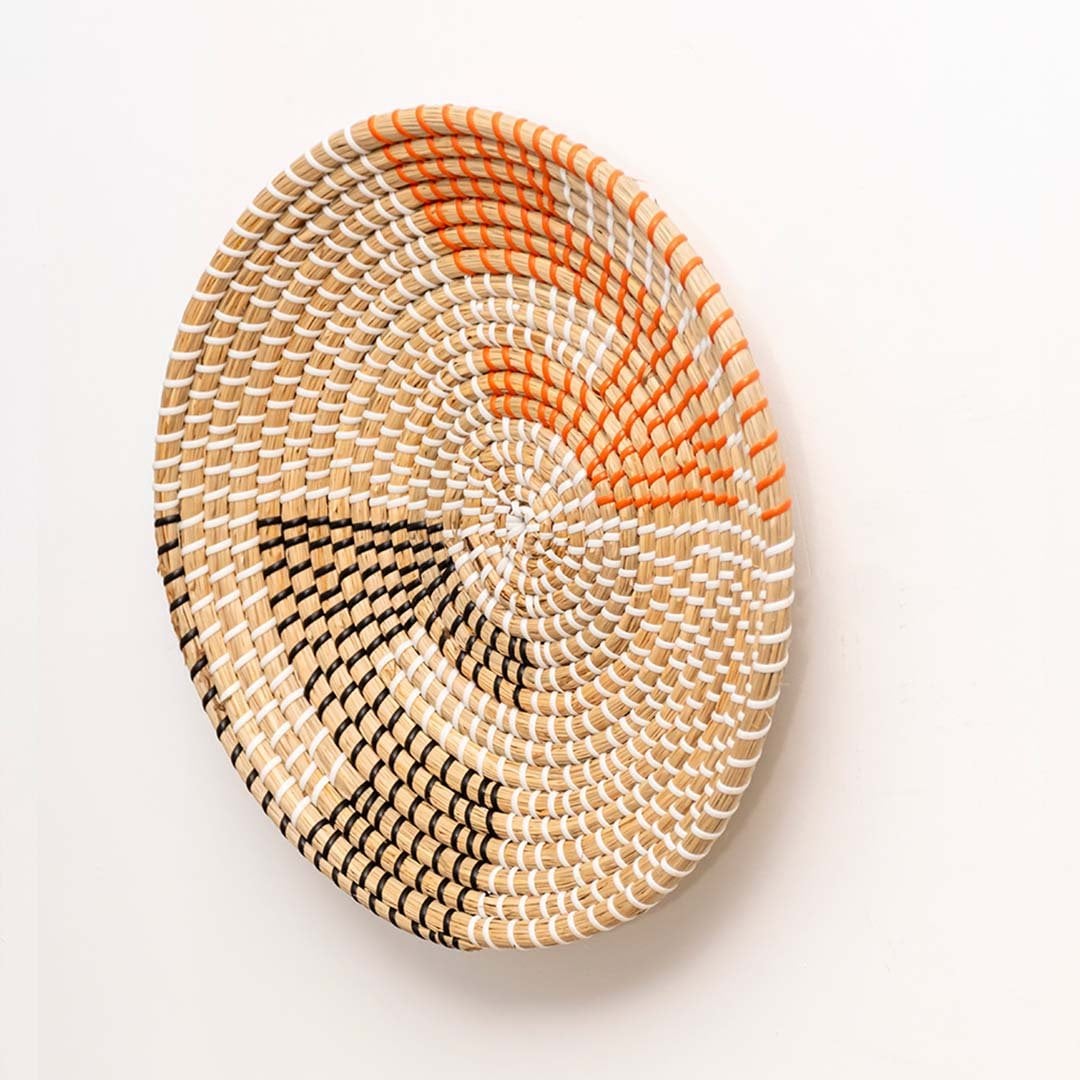 Side view of handwoven wicker basket wall decor showing woven depth and texture for rustic boho and modern interiors.