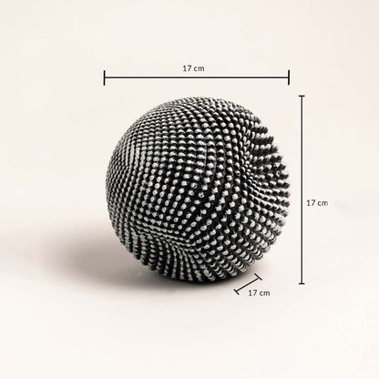 Textured black and white ball sculpture showing 17 cm height width and depth dimensions.