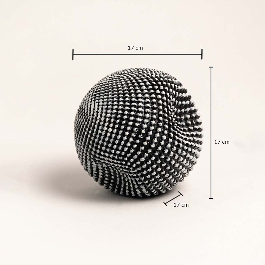 Textured black and white ball sculpture showing 17 cm height width and depth dimensions.
