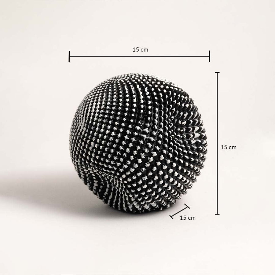 Black and white textured sphere sculpture showing 15 cm height width and depth dimensions.